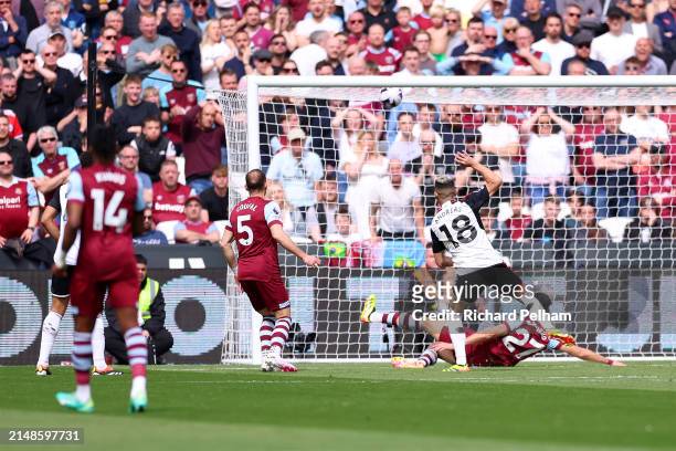 Andreas Pereira of Fulham scores his team's first goal during the Premier League match between West Ham United and Fulham FC at London Stadium on...