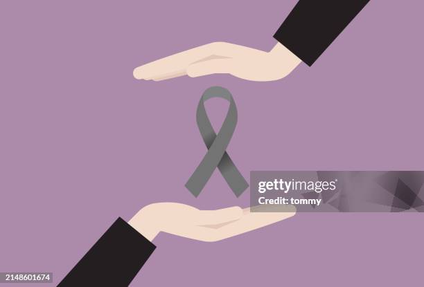grey ribbon symbol for brain cancer awareness month - brain cancer stock illustrations