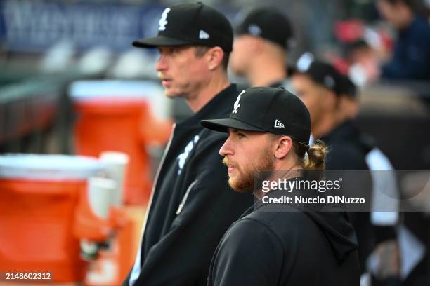 Tim Hill of the Chicago White Sox stands next to Michael Kopech of the Chicago White Sox in the dugout prior to a game against the Cincinnati Reds at...