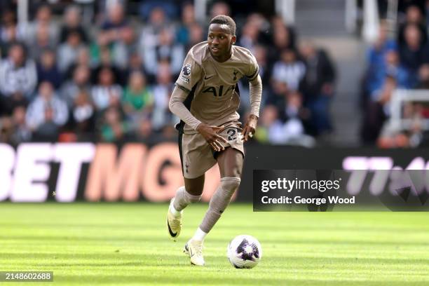 Pape Matar Sarr of Tottenham Hotspur runs with the ball during the Premier League match between Newcastle United and Tottenham Hotspur at St. James...