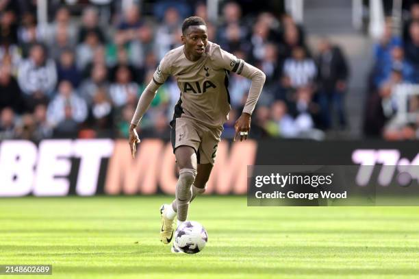 Pape Matar Sarr of Tottenham Hotspur runs with the ball during the Premier League match between Newcastle United and Tottenham Hotspur at St. James...