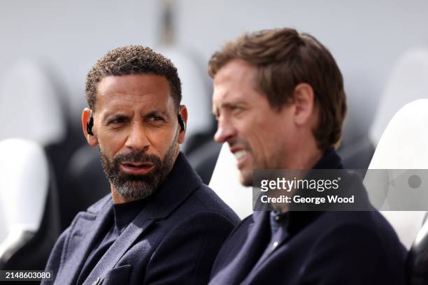 Pundit and former footballer, Rio Ferdinand interacts with Pundit and former footballer, Peter Crouch prior to the Premier League match between...
