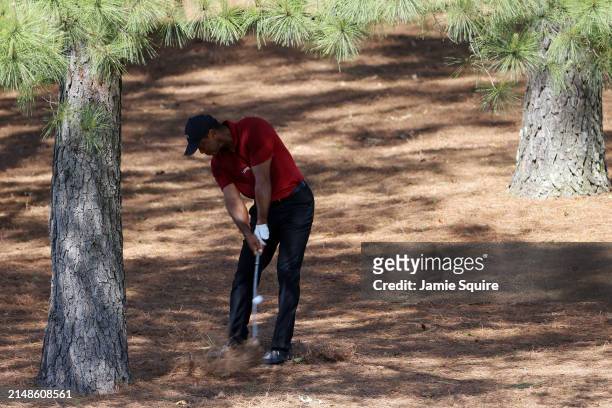 Tiger Woods of the United States plays his shot on the ninth hole during the final round of the 2024 Masters Tournament at Augusta National Golf Club...