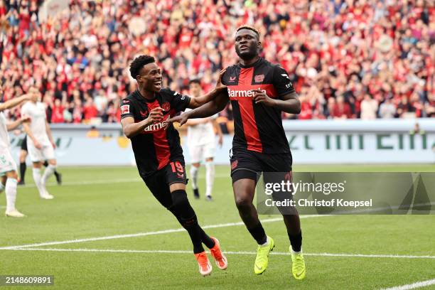 Victor Boniface of Bayer Leverkusen celebrates scoring his team's first goal from the penalty spot during the Bundesliga match between Bayer 04...