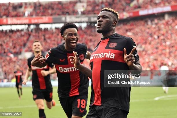 Victor Boniface of Bayer Leverkusen celebrates scoring his team's first goal from the penalty spot during the Bundesliga match between Bayer 04...