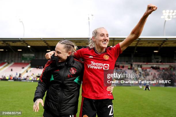 Leah Galton and Millie Turner of Manchester United Women celebrate the team's victory after the Adobe Women's FA Cup Semi Final match between...