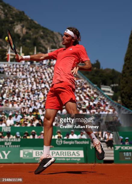 Stefanos Tsitsipas of Greece plays a backhand against Casper Ruud of Norway during the Men's Double's Final on day eight of the Rolex Monte-Carlo...