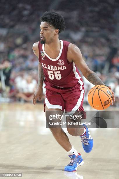 Aaron Estrada of the Alabama Crimson Tide dribbles the ball during the NCAA Mens Basketball Tournament Final Four semifinal game against The...