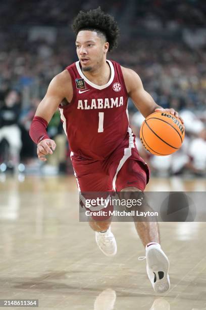 Mark Sears of the Alabama Crimson Tide dribbles the ball during the NCAA Mens Basketball Tournament Final Four semifinal game agains The Connecticut...