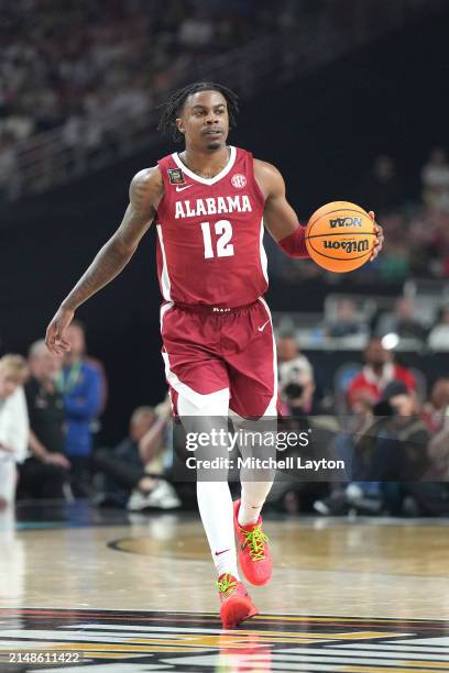 Latrell Wrightsell Jr. #12 of the Alabama Crimson Tide dribbles the ball during the NCAA Mens Basketball Tournament Final Four semifinal game against...