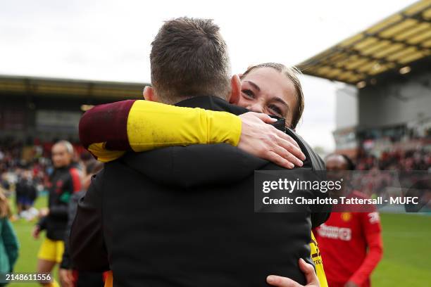 Manager Marc Skinner and Mary Earps of Manchester United Women celebrate the team's victory after the Adobe Women's FA Cup Semi Final match between...