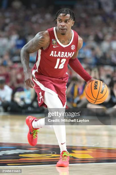 Latrell Wrightsell Jr. #12 of the Alabama Crimson Tide dribbles the ball during the NCAA Mens Basketball Tournament Final Four semifinal game against...