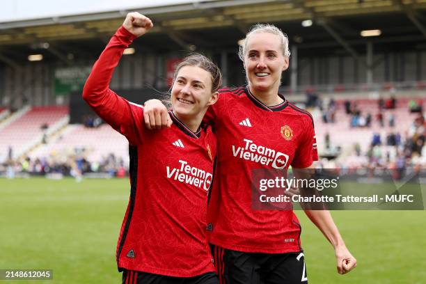 Hannah Blundell and Millie Turner of Manchester United Women celebrate the team's victory after the Adobe Women's FA Cup Semi Final match between...