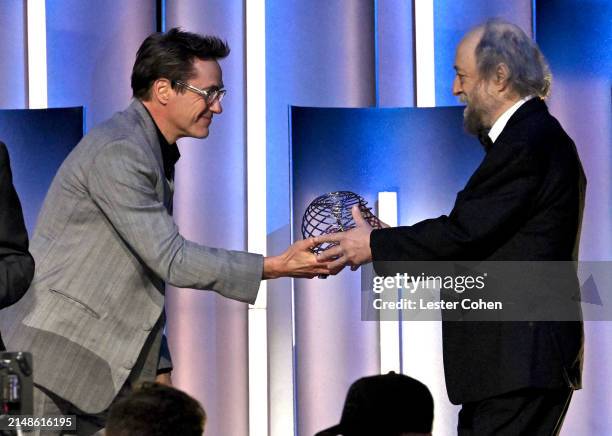 Robert Downey Jr. And honoree Dr. Alexander Zamolodchikov onstage during the 10th Breakthrough Prize Ceremony at the Academy of Motion Picture Arts...