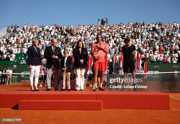 Stefanos Tsitsipas of Greece holds his trophy as he speaks on court alongside Charlene, Princess of Monaco, Prince Albert II of Monaco, Prince...