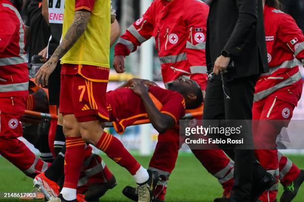 Evan Ndicka of AS Roma injured during the Serie A TIM match between Udinese Calcio and AS Roma at Dacia Arena on April 14, 2024 in Udine, Italy.