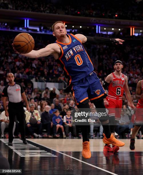 Donte DiVincenzo of the New York Knicks keeps the loose ball in bounds during the first half against the Chicago Bulls at Madison Square Garden on...