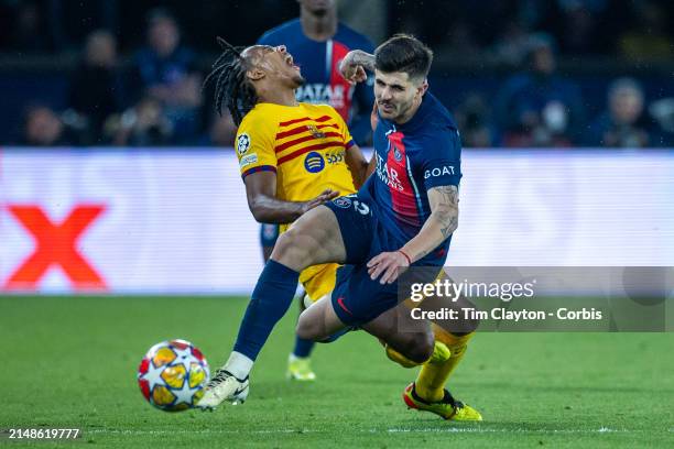Jules Koundé of Barcelona and Nuno Mendes of Paris Saint-Germain collide during the Paris Saint-Germain V Barcelona, UEFA Champions League,...