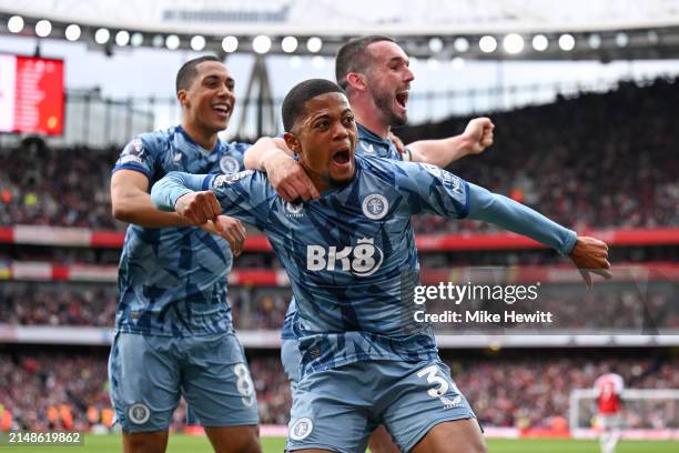 Leon Bailey of Aston Villa celebrates with team mates John McGinn and Youri Tielemans after opening the scoring during the Premier League match...