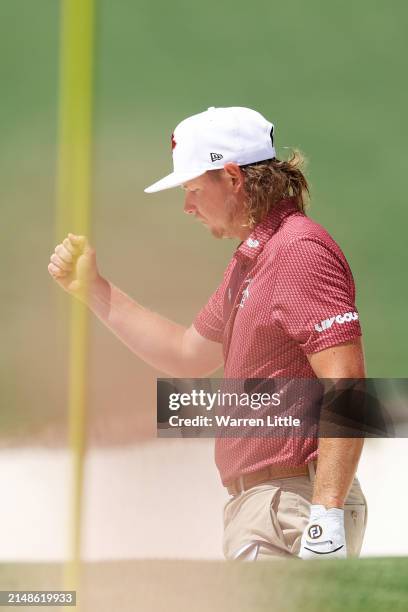 Cameron Smith of Australia reacts after chipping in from the bunker for eagle on the second hole during the final round of the 2024 Masters...