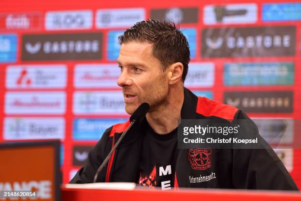 Xabi Alonso, Head Coach of Bayer Leverkusen, speaks to the media in a post-match press conference after winning the Bundesliga title for the first...