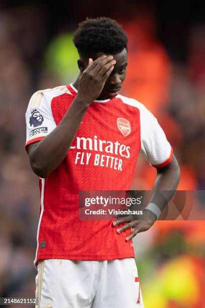 Bukayo Saka of Arsenal reacts during the Premier League match between Arsenal FC and Aston Villa at Emirates Stadium on April 14, 2024 in London,...