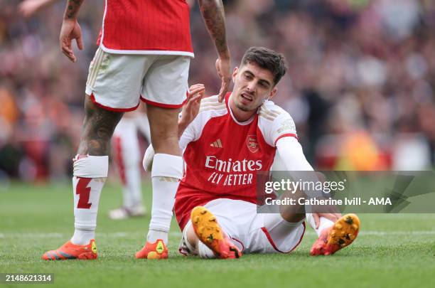 Kai Havertz of Arsenal is helped up during the Premier League match between Arsenal FC and Aston Villa at Emirates Stadium on April 14, 2024 in...