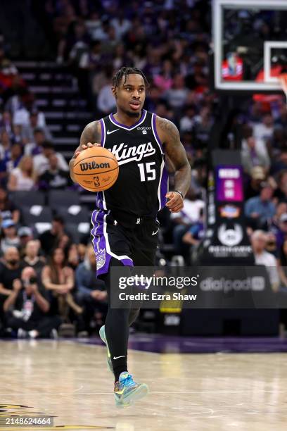 Davion Mitchell of the Sacramento Kings dribbles the ball against the LA Clippers at Golden 1 Center on April 02, 2024 in Sacramento, California....