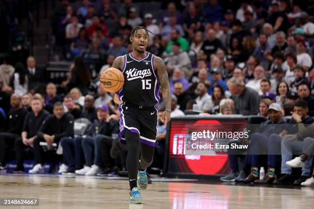 Davion Mitchell of the Sacramento Kings dribbles the ball against the LA Clippers at Golden 1 Center on April 02, 2024 in Sacramento, California....