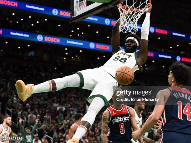 Neemias Queta of the Boston Celtics drunks and scores against the Washington Wizards during the fourth quarter at the TD Garden on April 14, 2024 in...