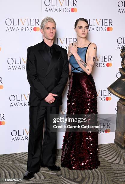 Luke Treadaway and Cara Delevingne pose in the winners room at The Olivier Awards 2024 at The Royal Albert Hall on April 14, 2024 in London, England.