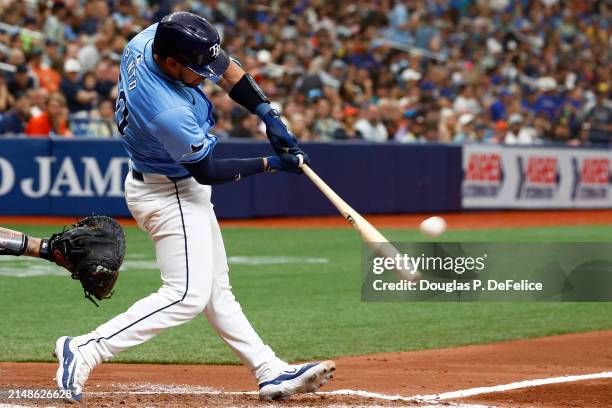 René Pinto of the Tampa Bay Rays hits a three run home run against the San Francisco Giants during the fourth inning at Tropicana Field on April 14,...
