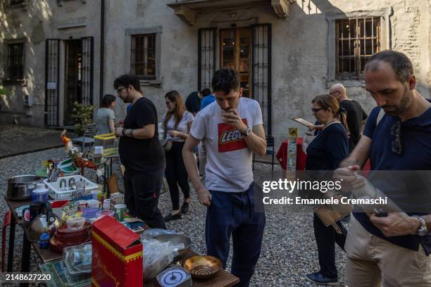 People look and snoop at second hand items during a swap event organized by the NPO Stooping Milano at Cascina Cuccagna on April 14, 2024 in Milan,...