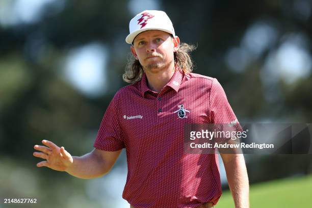 Cameron Smith of Australia reacts after making par on the eighth green during the final round of the 2024 Masters Tournament at Augusta National Golf...