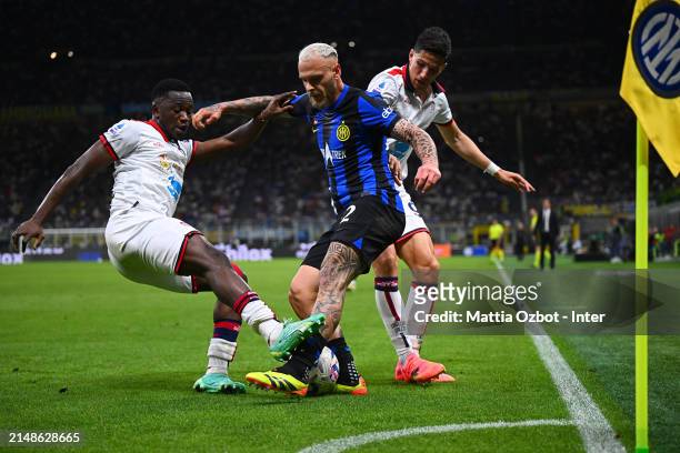 Federico Dimarco of FC Internazionale, in action, battles for the ball during the Serie A TIM match between FC Internazionale and Cagliari at Stadio...