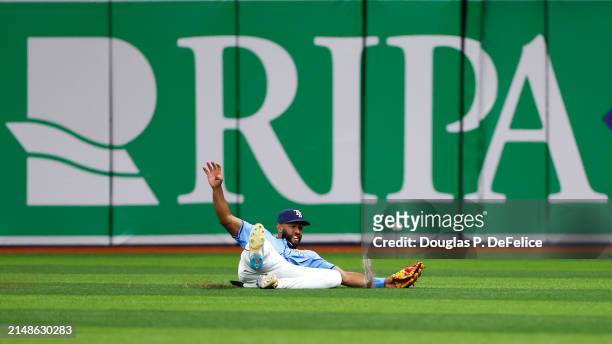 Amed Rosario of the Tampa Bay Rays attempts to catch a fly ball during the ninth inning against the San Francisco Giants at Tropicana Field on April...