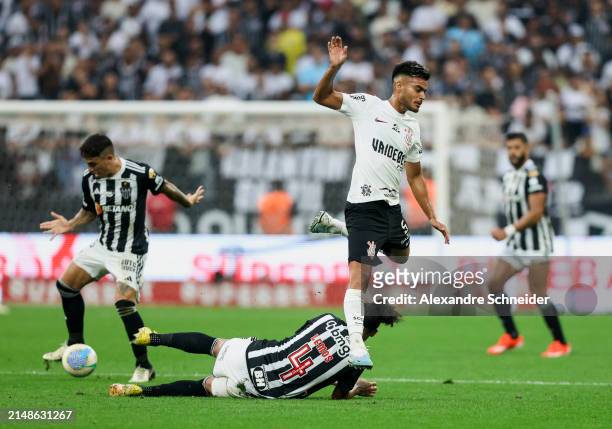 Mauricio Lemos of Atletico MG and Fausto Vera of Corinthians fight for the ball during a match between Corinthians and Atletico MG as part of...