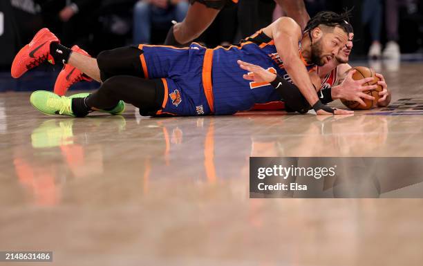 Jalen Brunson of the New York Knicks and Alex Caruso of the Chicago Bulls go after the loose ball during the second half at Madison Square Garden on...