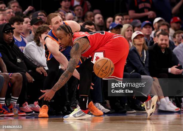 Donte DiVincenzo of the New York Knicks tries to in bound the ball as DeMar DeRozan of the Chicago Bulls defends in the final minute of the game...