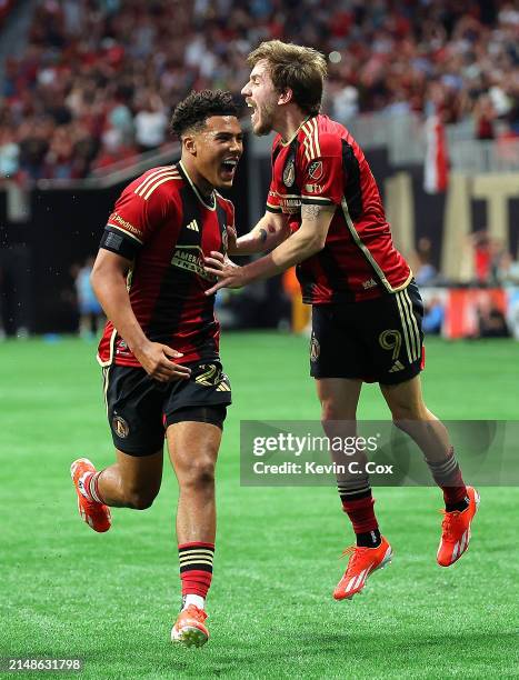 Caleb Wiley of Atlanta United reacts with Saba Lobjanidze after scoring a goal against Quinn Sullivan of Philadelphia Union during the second half at...