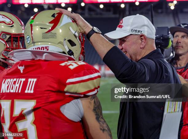 Birmingham Stallions head coach Skip Holtz and Scooby Wright share a late game laugh against the Memphis Showboats at Protective Stadium on April 13,...