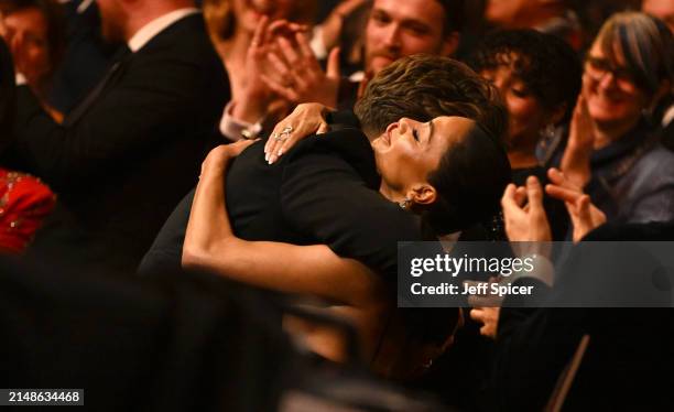 Nicole Scherzinger hugs Tom Francis during The Olivier Awards 2024 at The Royal Albert Hall on April 14, 2024 in London, England.