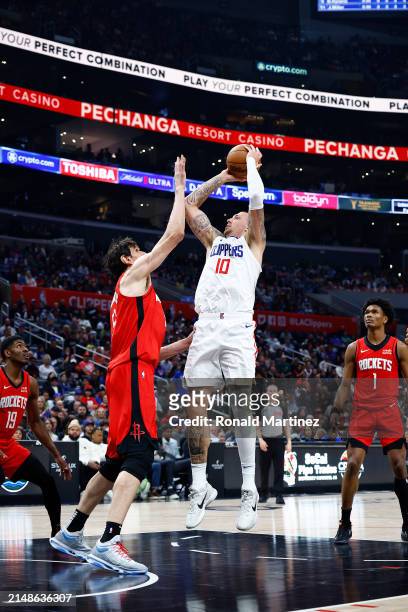 Daniel Theis of the LA Clippers takes a shot against Boban Marjanovic of the Houston Rockets in the second half at Crypto.com Arena on April 14, 2024...