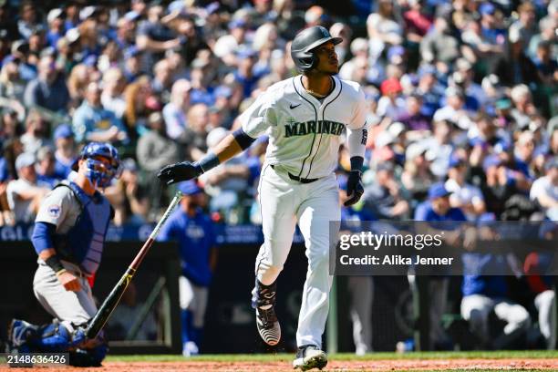 Jorge Polanco of the Seattle Mariners hits a two-run home run during the seventh inning against the Chicago Cubs at T-Mobile Park on April 14, 2024...