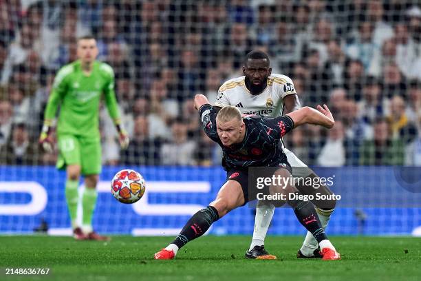 Antonio Rudiger of Real Madrid battle for the ball with Erling Haaland of Manchester City during the UEFA Champions League quarter-final first leg...