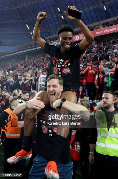 Nathan Tella of Bayer Leverkusen celebrates winning the Bundesliga title for the first time in their history after the Bundesliga match between Bayer...