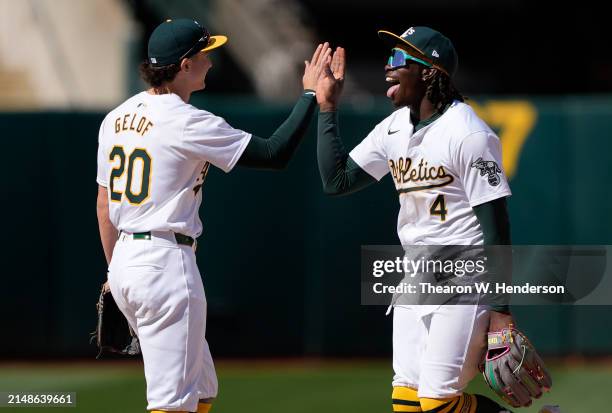 Lawrence Butler and Zack Gelof of the Oakland Athletics celebrates defeating the Washington Nationals 7-6 on April 14, 2024 at the Oakland Coliseum...