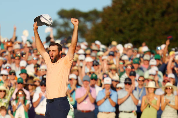 Scottie Scheffler of the United States celebrates on the 18th green after winning the 2024 Masters Tournament at Augusta National Golf Club on April...