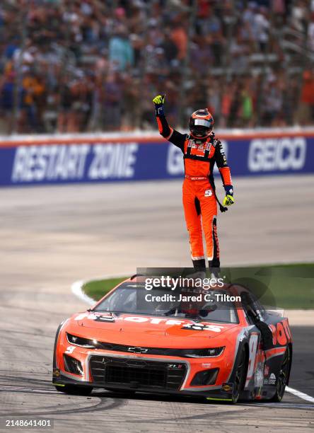 Chase Elliott, driver of the Hooters Chevrolet, celebrates after winning the NASCAR Cup Series AutoTrader EchoPark Automotive 400 at Texas Motor...