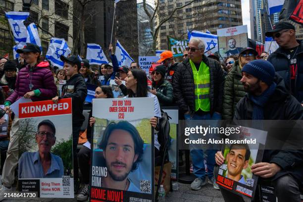 Daniel Lifshitz looks at his daughter Lilou Lifshitz before she speaks at the "Bring Them Home Now" rally outside the UN on April 7, 2024 in New York...